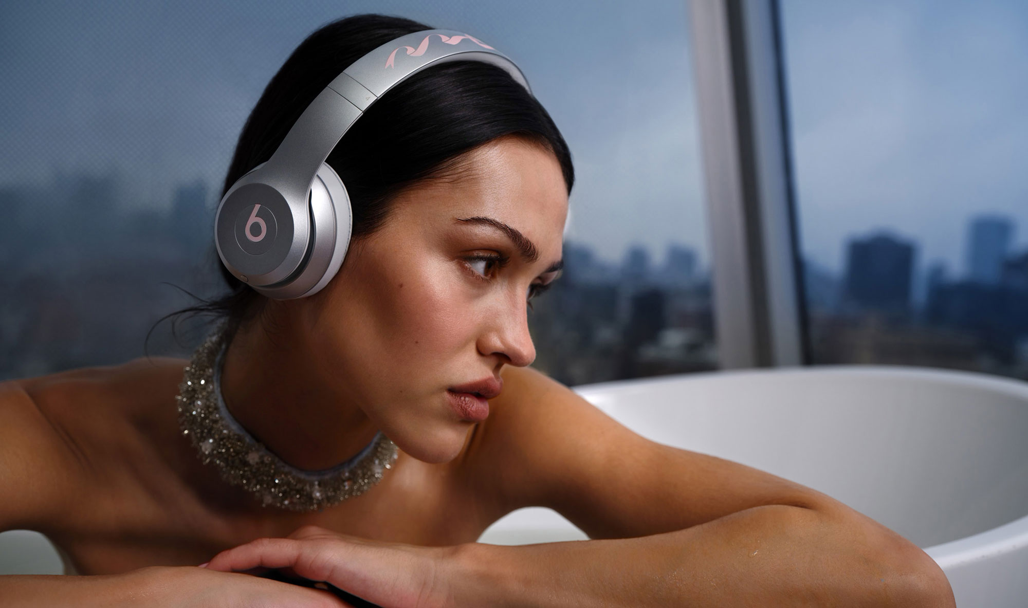 Sandy Liang's Limited Edition Beats Solo 4 headphones in metallic silver with pink ribbon design