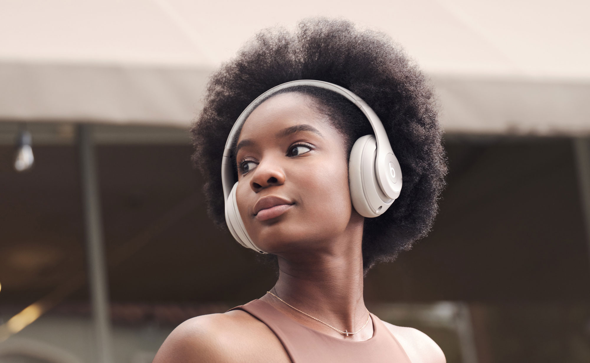 Woman wearing Beats Studio Pro