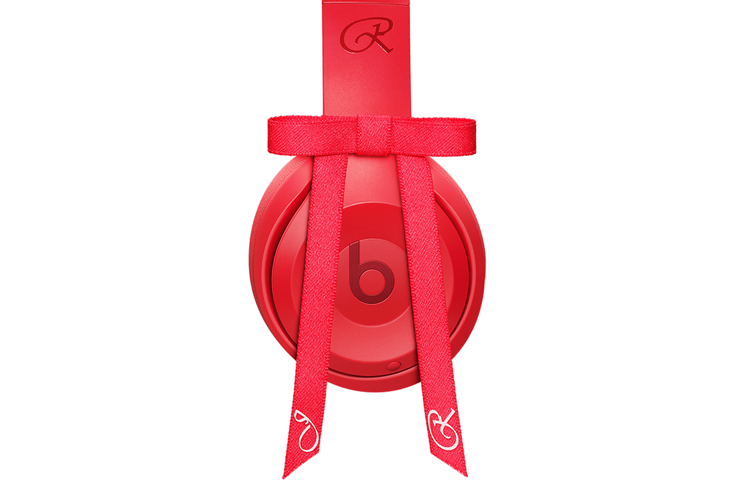 Side view of the Beats Solo 4 - JENNIE Special Edition headphones in Ruby Red, showing the 