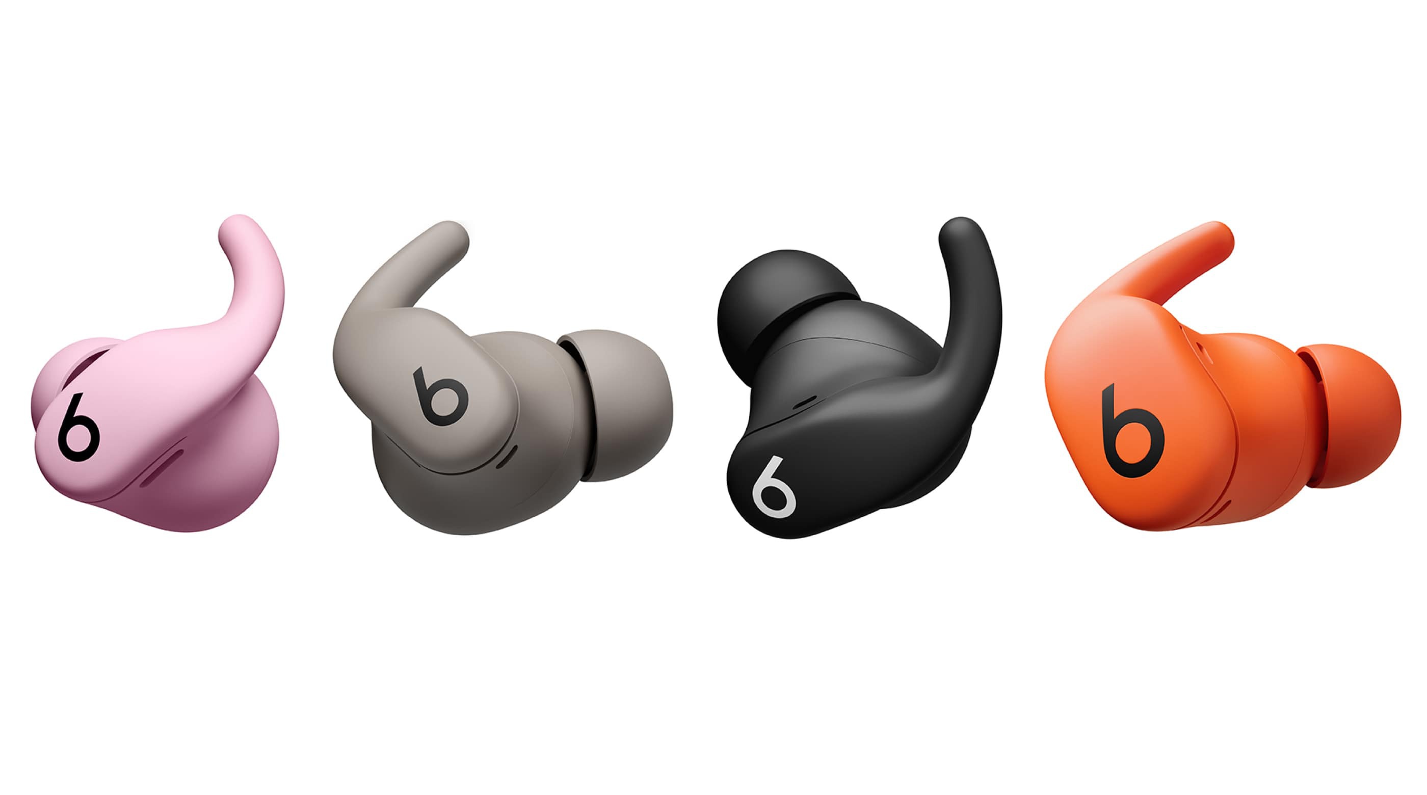 Powerbeats Fit lined up in Jet Black, Gravel Gray, Spark Orange, and Power Pink.