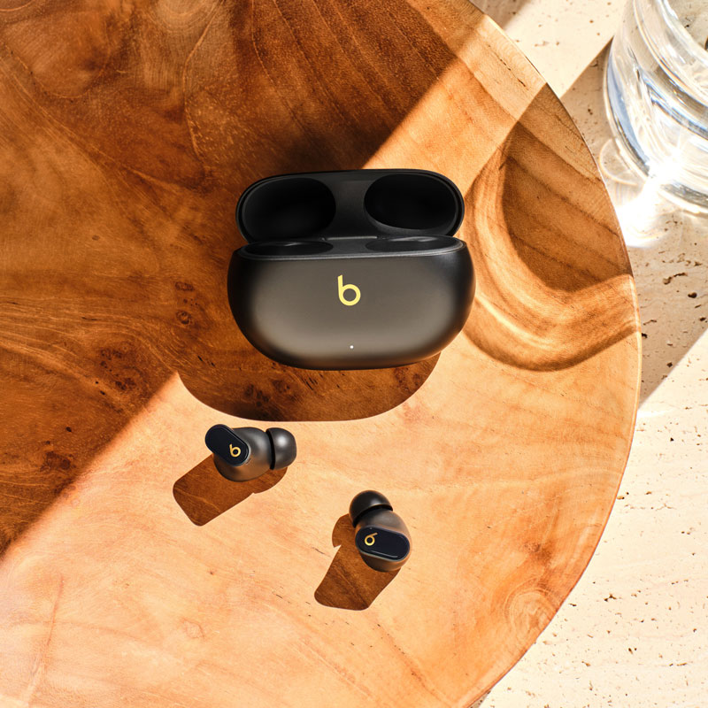 Beats Studio Buds + in Black on a table
