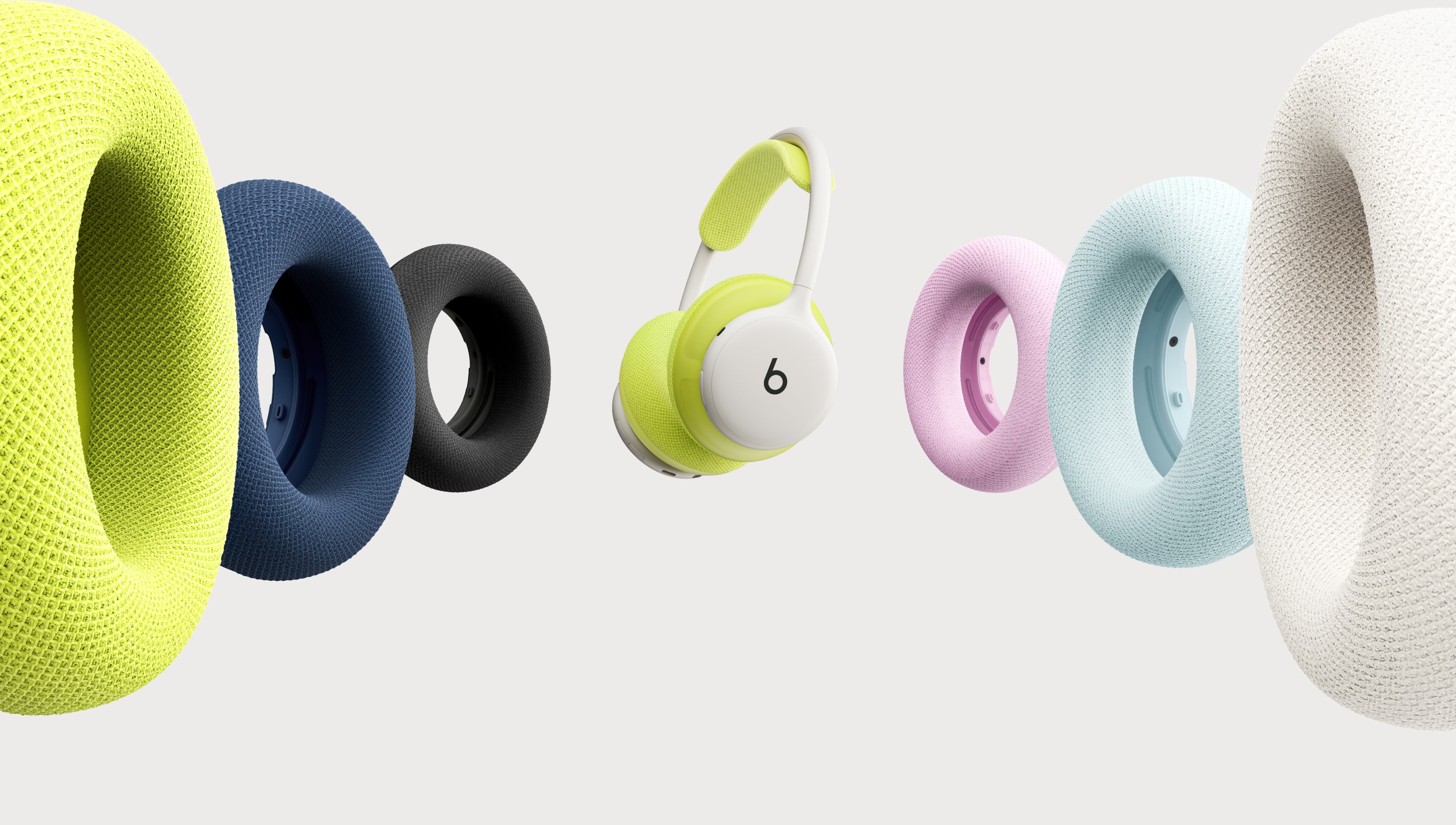 Beats 360 headphones in Black showing interchangeable cushion colour options