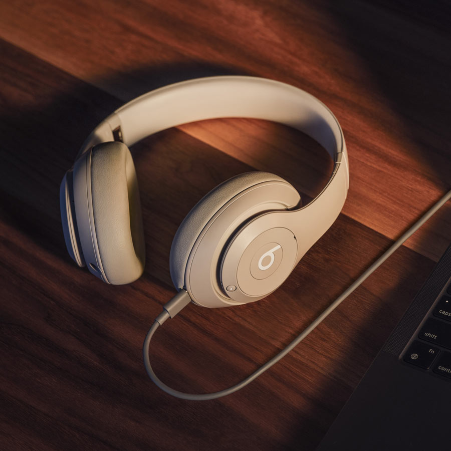 Beats Studio Pro in Sandstone with USB-C cable plugged in